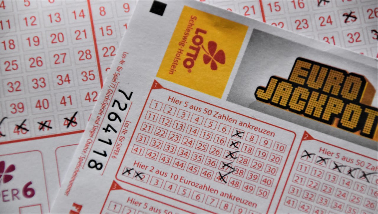 about-img Detailed close-up of a EuroJackpot lottery ticket with selected numbers in focus.